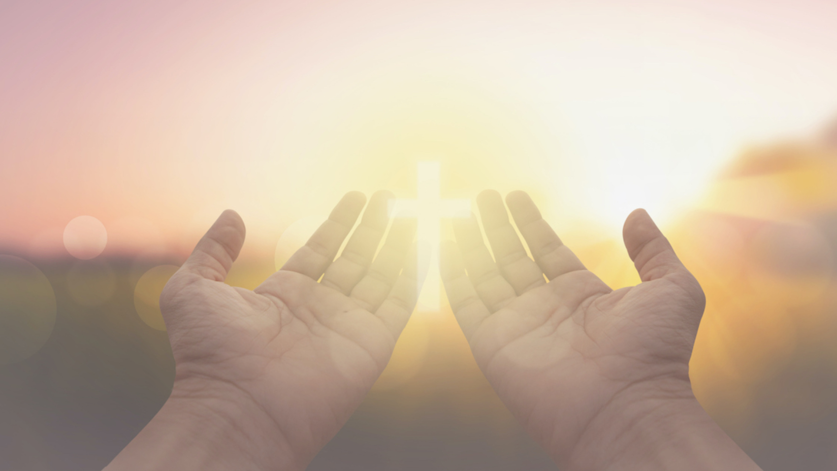 hand and jesus at sunrise nature background